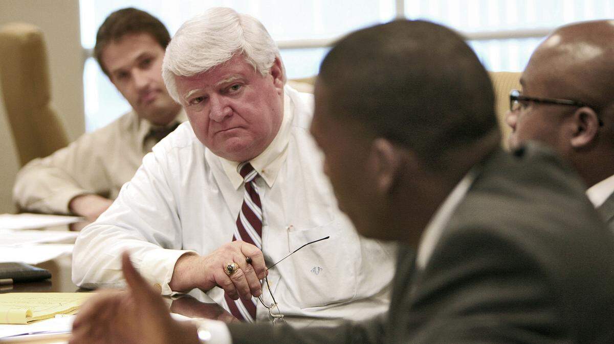 March 14, 2007: Chief Justice R. Fred Lewis of the Florida Supreme Court, center, listens to Robert Vaughan, right, Caribbean Bar Association, during an informal meeting with minority bar heads in Miami to address diversity and fairness training for Florida judges. Bill Gelin, Justice Advocacy Association of Broward, listens at left. 